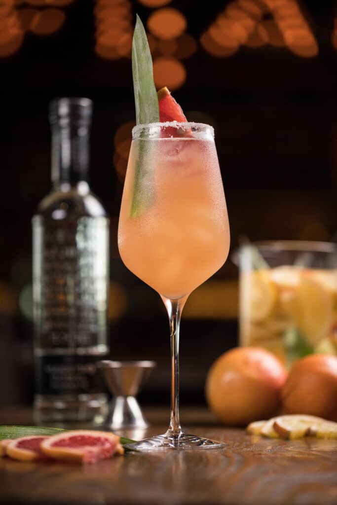 vertical shot of an iced alcohol cocktail in a big glass